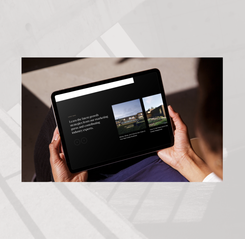 Real estate agent holding tablet displaying blog content 