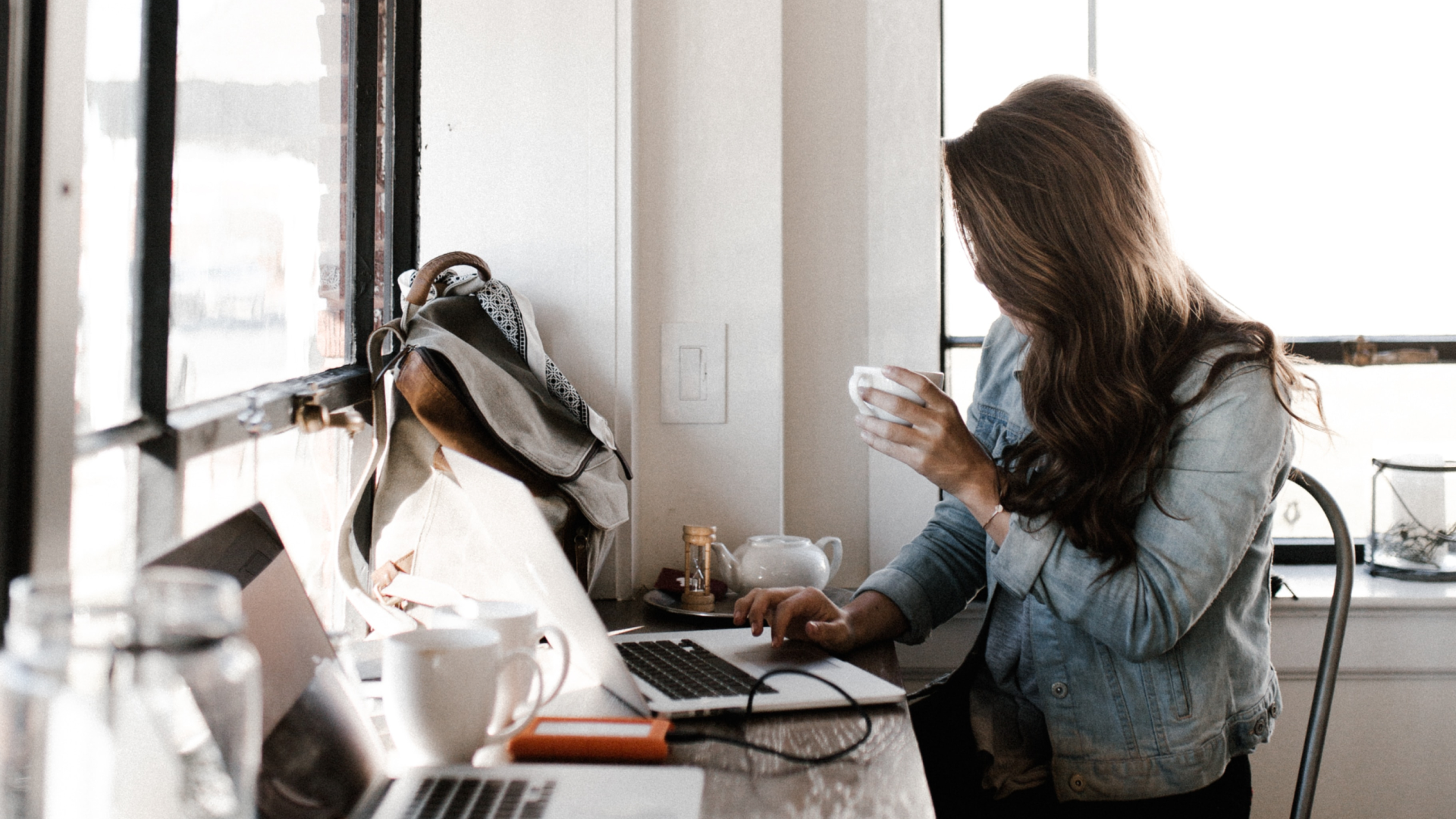 real estate agent using laptop to set up a virtual real estate tour